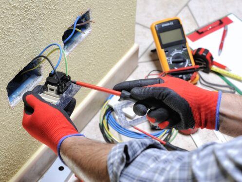 Electrician Installing GFCI Outlet in Dallas-Fort Worth, Texas